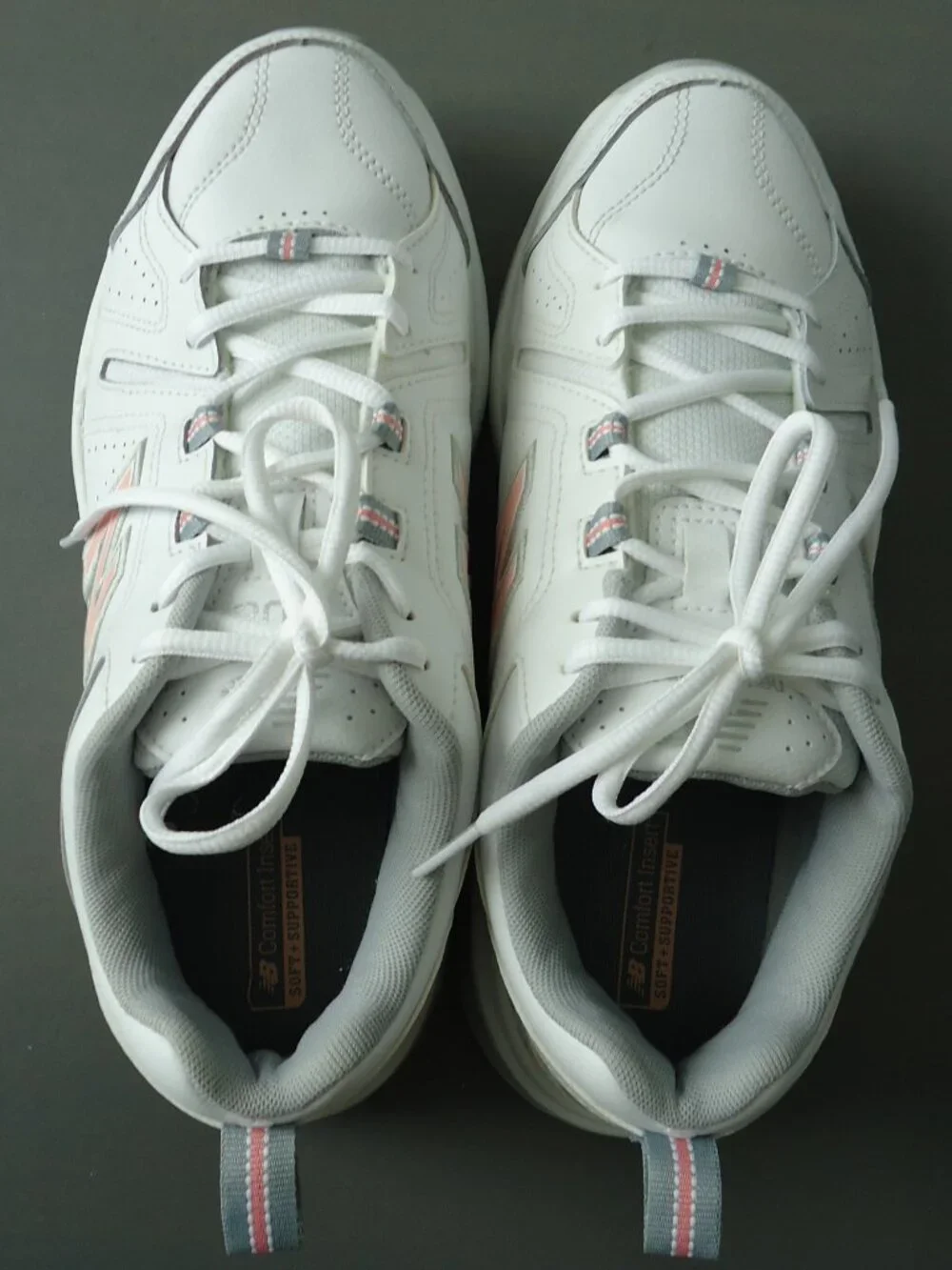 SIZE 9.5. D. New Balance women's white leather sneakers shoes.